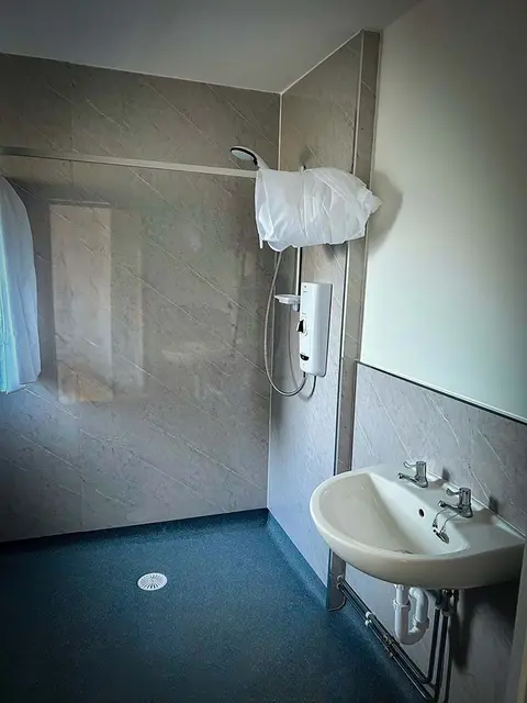 Completed level-access shower with non-slip flooring